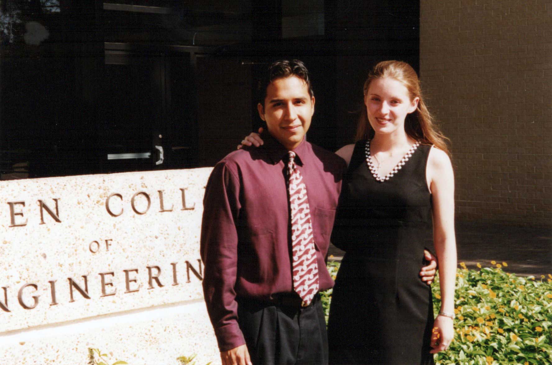 Jennifer and Julio Rios on graduation day in front of the Cullen College of Engineering at the University of Houston