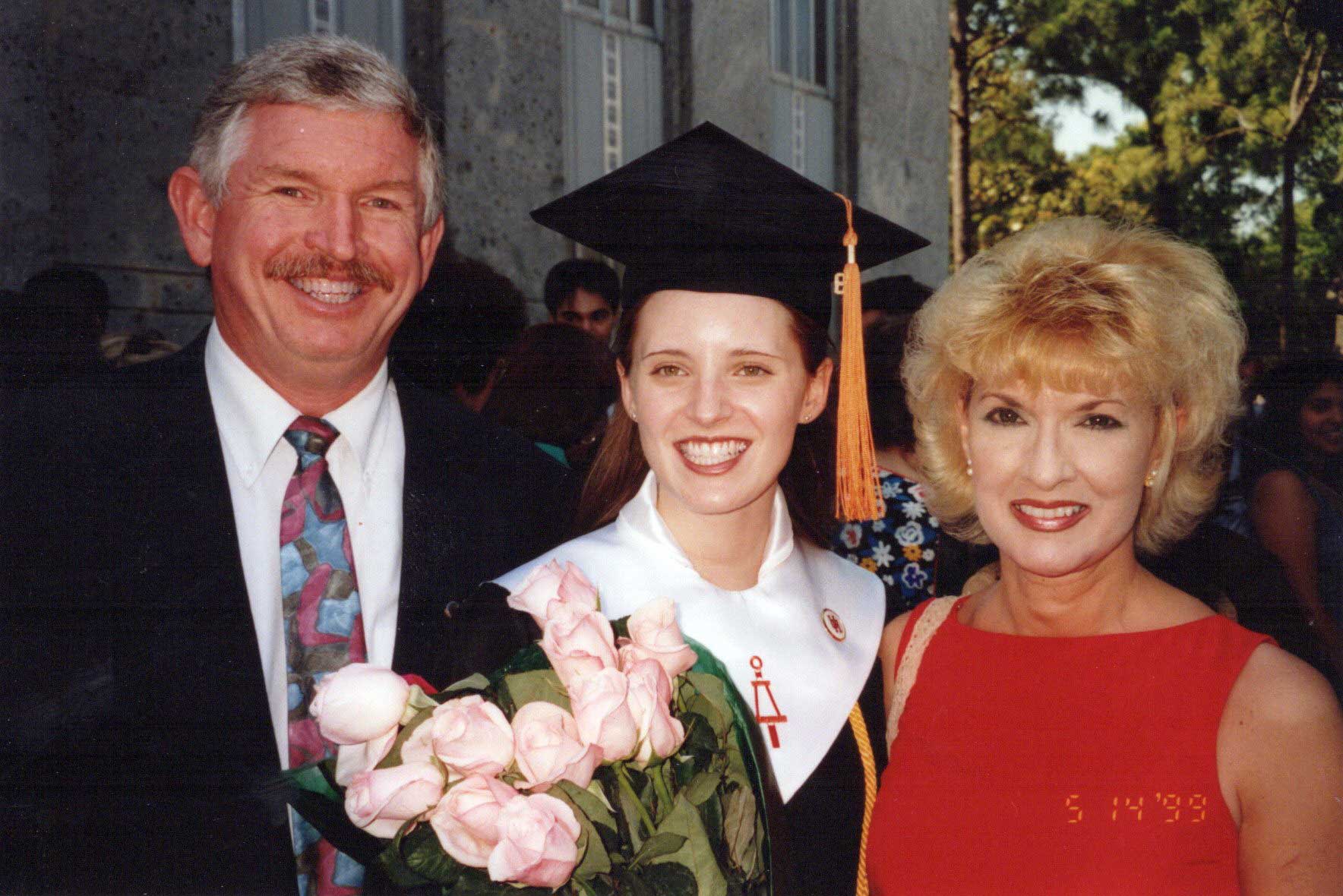 Jennifer Rios on college graduation day with her parents
