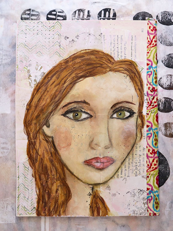 Painting of a girl with green eyes and light brown hair. She is on a mixed media background of book pages washed with light pink paint.