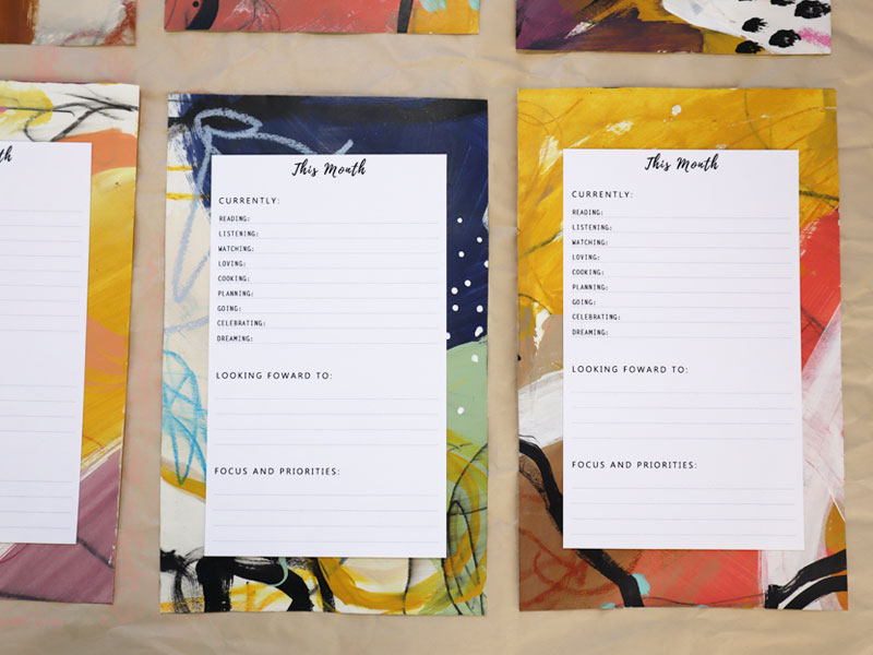 Custom planner pages mounted on abstract art
