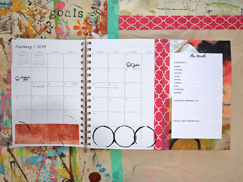 Monthly planner page with custom fold-in page added with washi tape